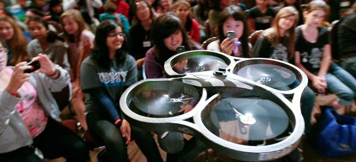 A radio-controlled drone, dubbed "Navy STEM Drone," flies near audience members before the Oh! Zone show at the 12th annual Science Technology Education Partnership Conference in Riverside, Calif., Oct. 26, 2011. 