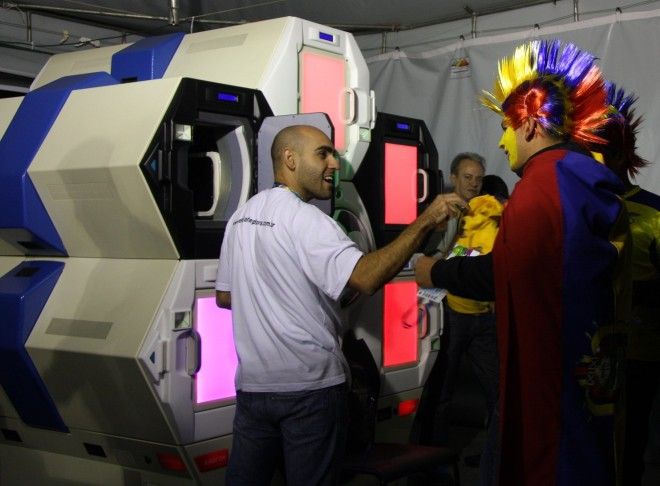 Fans at a World Cup game at Arena de Baixada stadium in Curitiba, Brazil use the Qylatron to go through security.